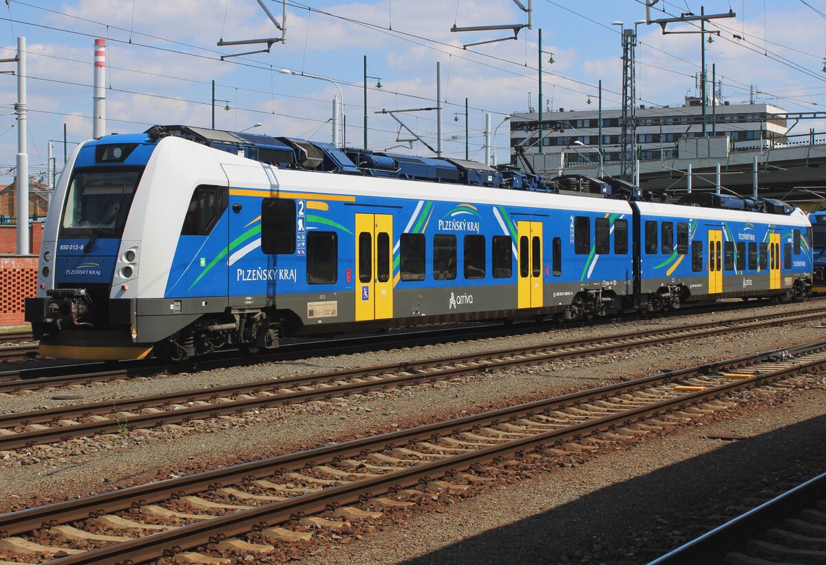 Arriva Vlaky 650 012 stands sidelined at Plzen hl.n. on Sunday 12 May 2024. 