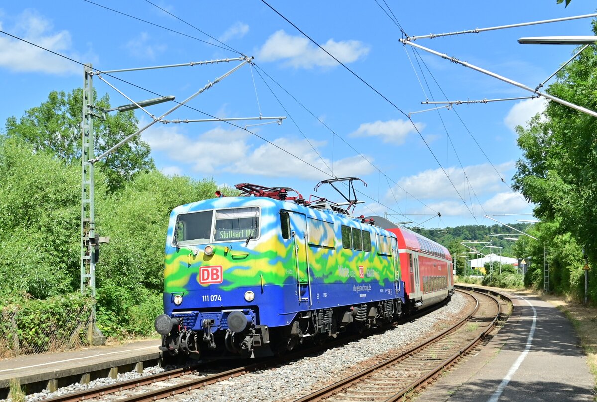 AT the Station of Herbolzheim at the Jagst river ride tthe  class 111 074 called Hilde with an replacementtrain RE8 from Würzburg Hbf nach Stuttgart Hbf at 5th july 2023

