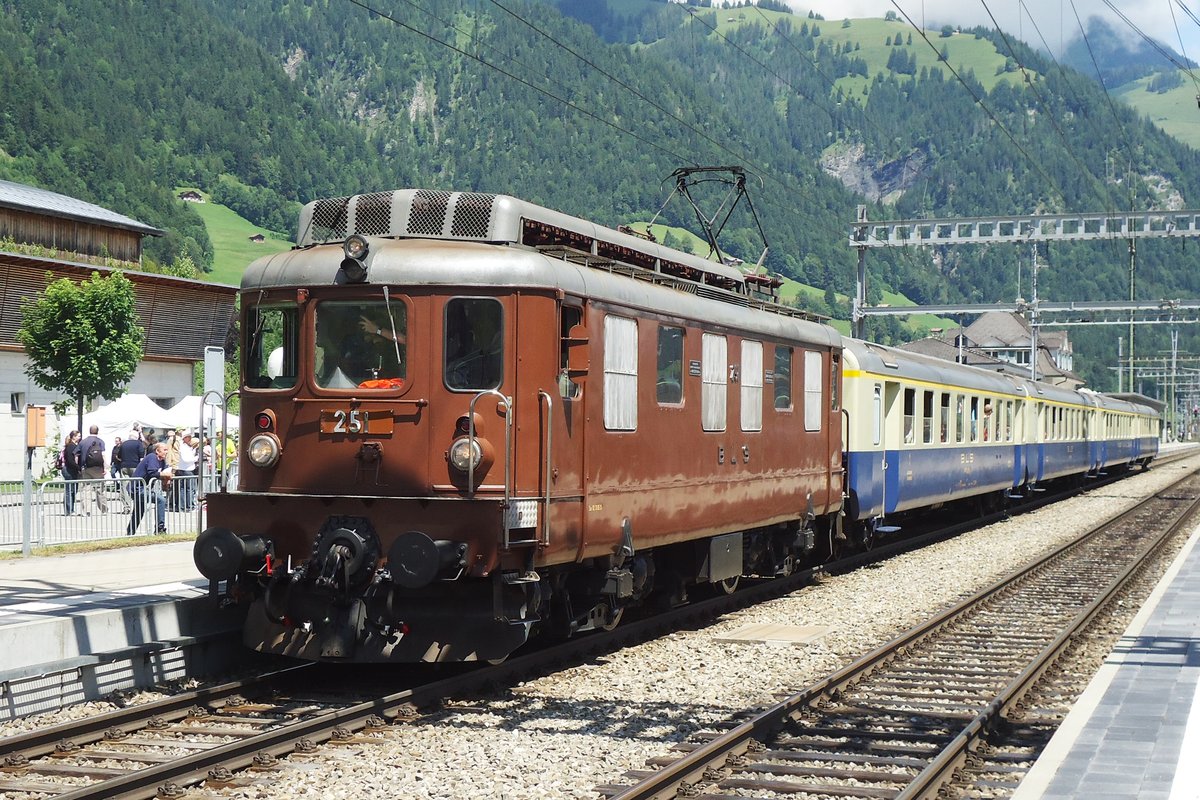 BLS 251 stands with historic stock at Frutigen on 30 June 2013. With these simple looking Ae 4/4, BLS ushered in the era of real high-powered fast electric locomotives with just trucks, from 1944. 