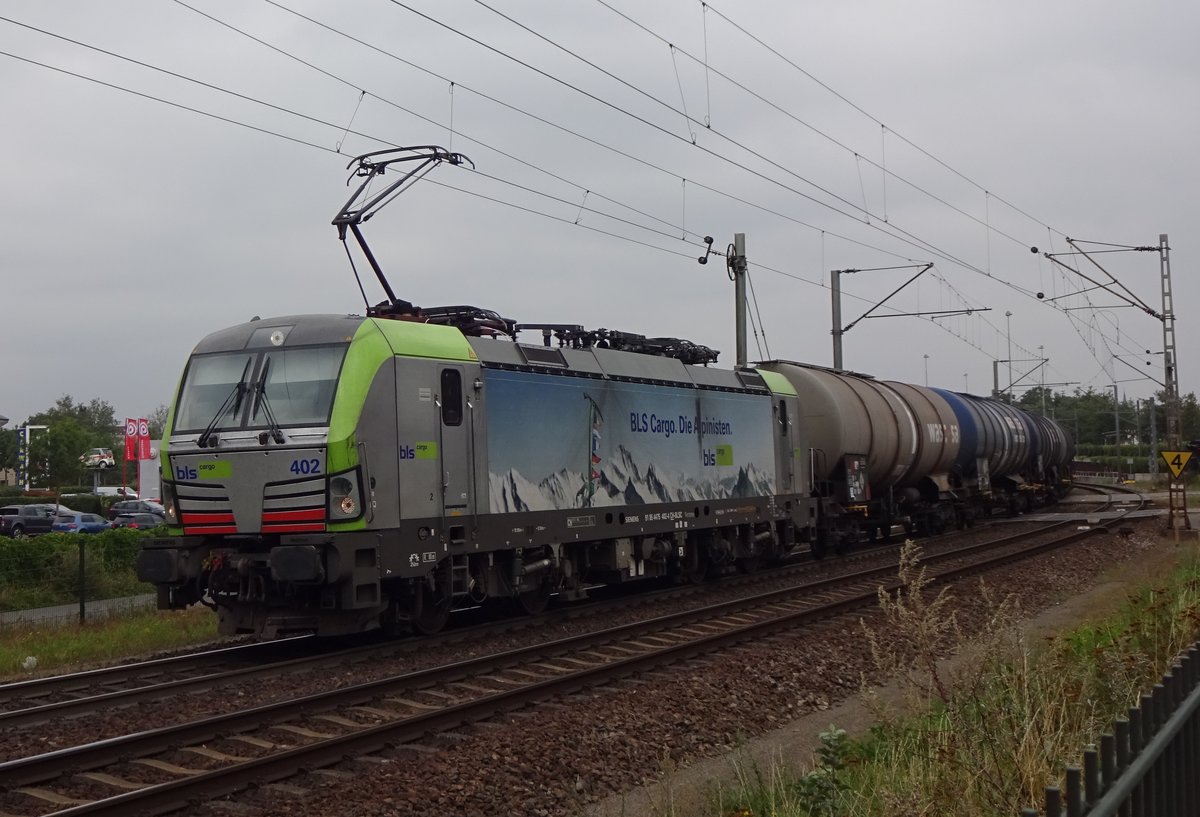 BLS 475 402 hauls a tank train out of Venlo on 27 August 2020.