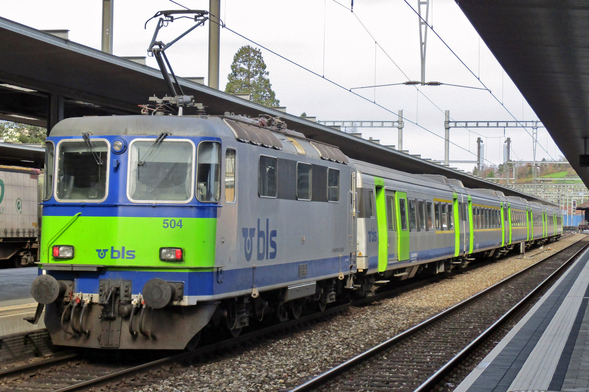 BLS 504 pushes a regional train to Zweisimmen out of Spiez on 23 March 2017.