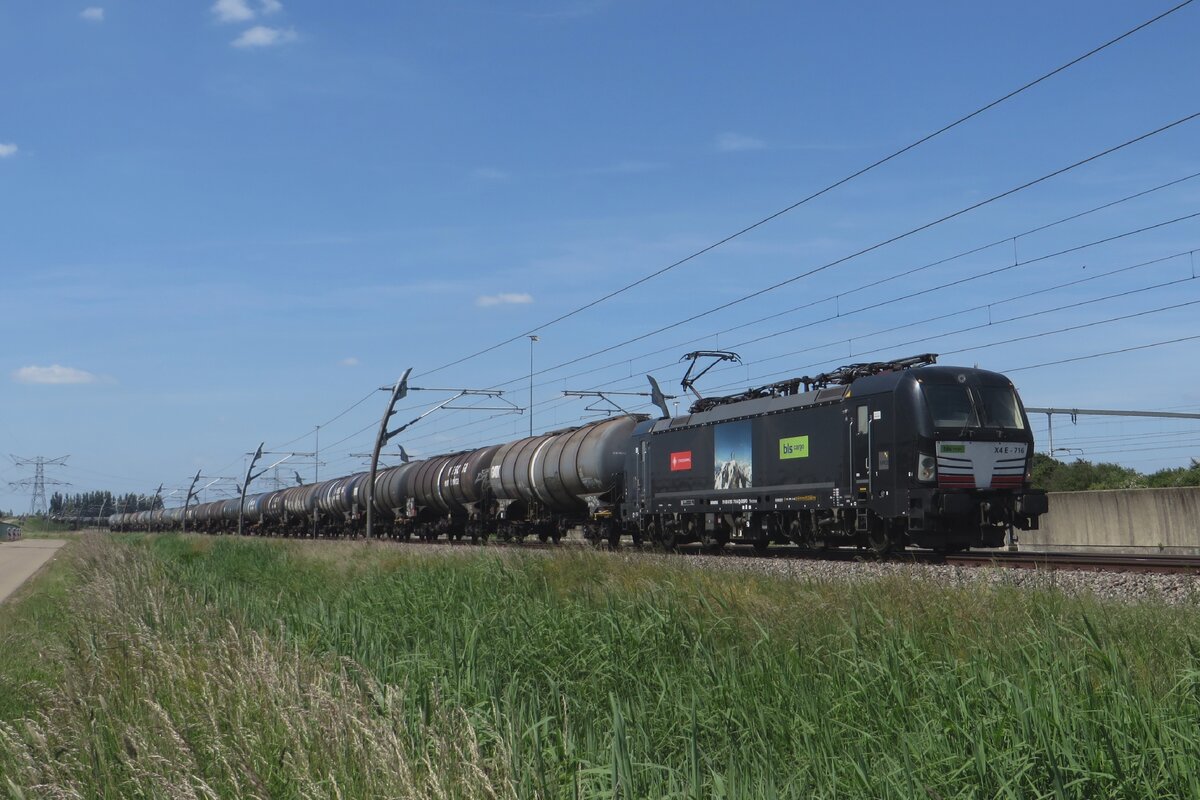 BLS Cargo X4E-716 hauls a tank train through Valburg CUP on 31 May 2023.