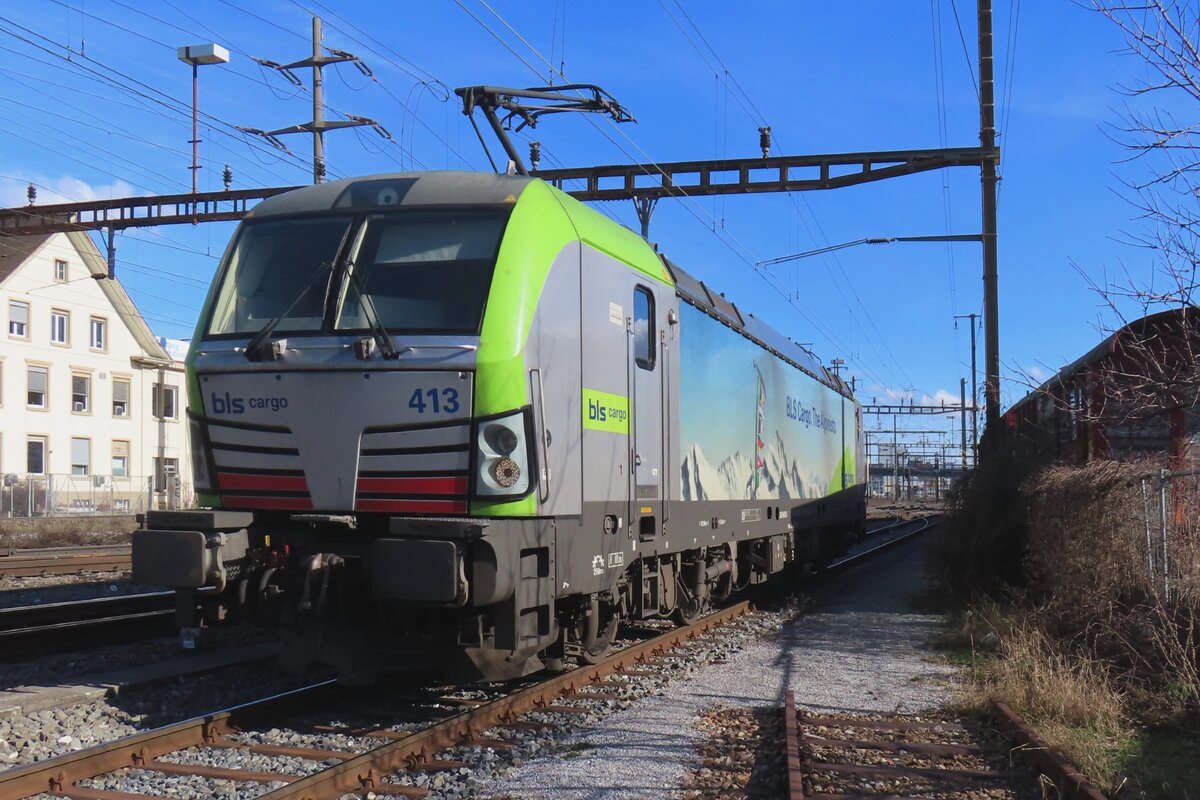 BLS Vectron 475 413 takes a break at Pratteln on 13 February 2024.