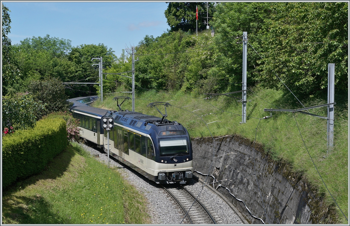 By Sonzier runs the MOB ABe 4/4 9302  Alpina  wiht his Regional train service from Zweisimmen to Montreux. 

May 28, 2024