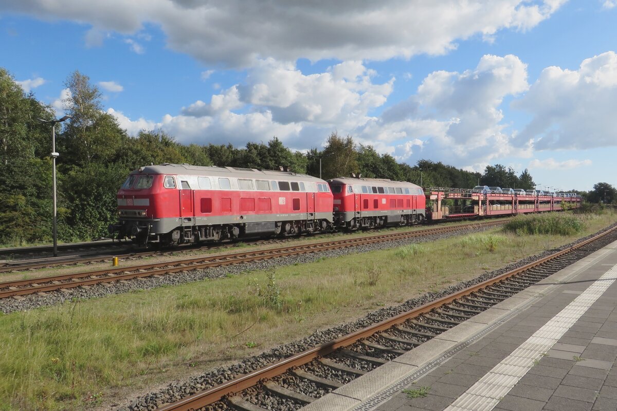 DB 218 397 hauls a car carrying Sylt-Shuttle train out of Niebüll on 20 September 2022.