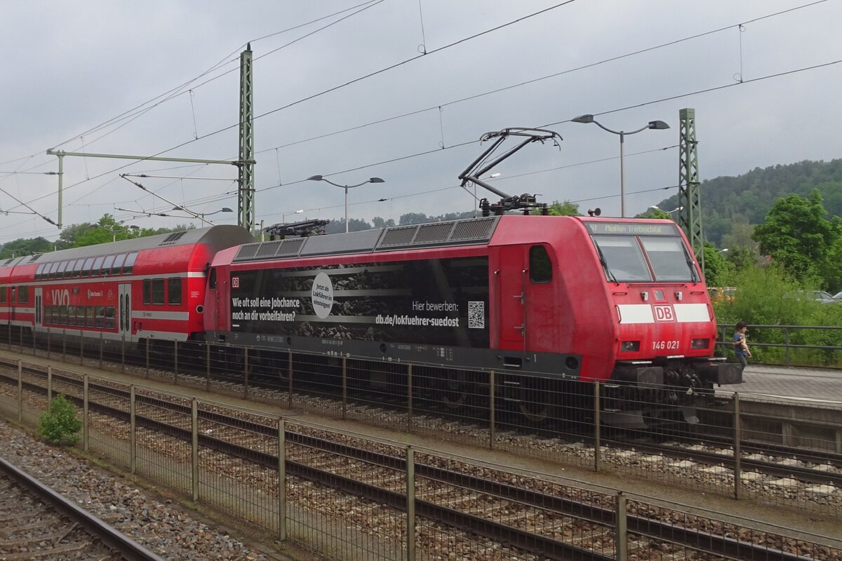 DB Regio 146 021 pushes an urban train out of Bad Schandau on 23 May 2023.