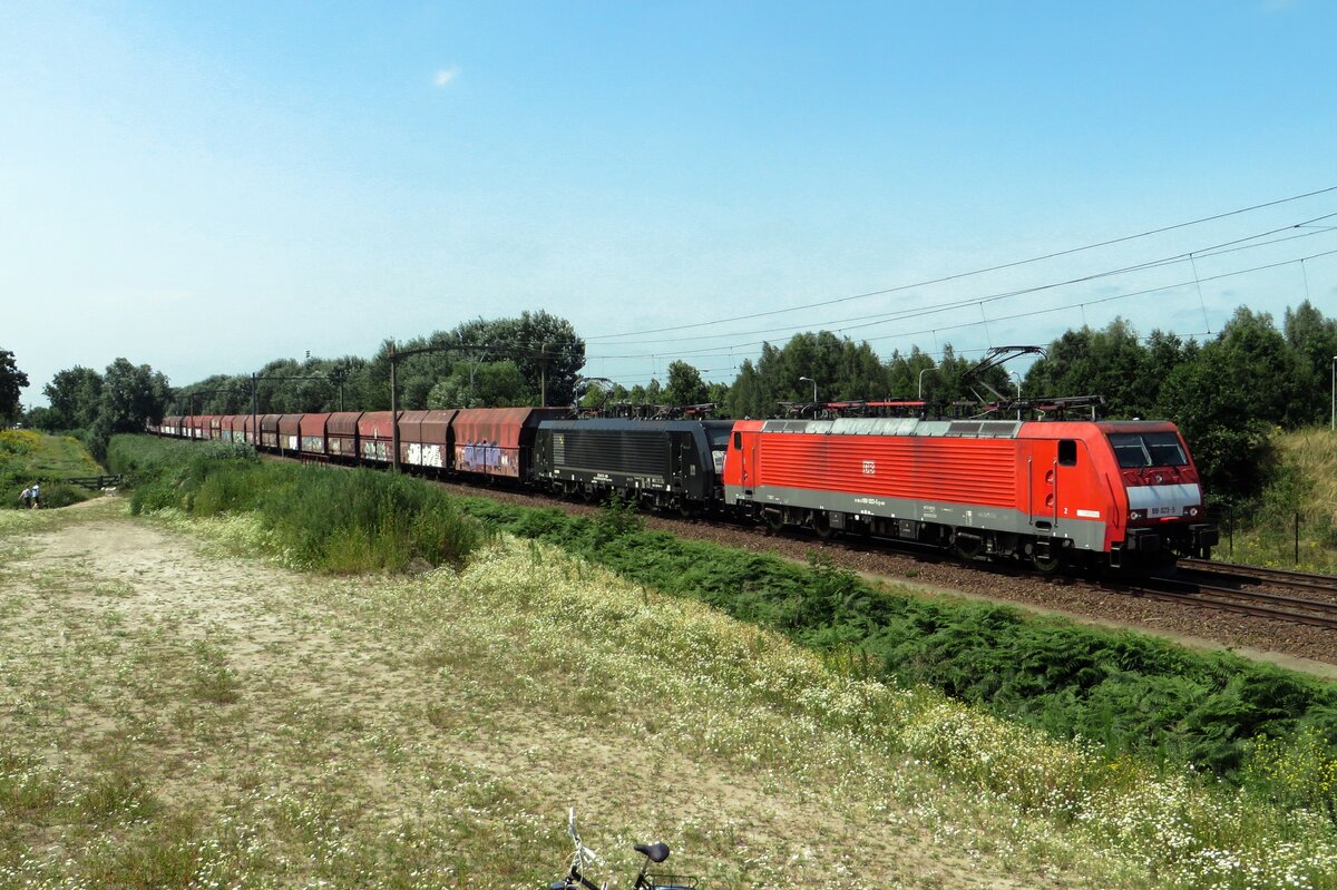 DBC 189 023 hauls a sister loco (that was bought back from MRCE in July!) and a coal train throguh Tilburg-Reeshof on 23 July 2021.
