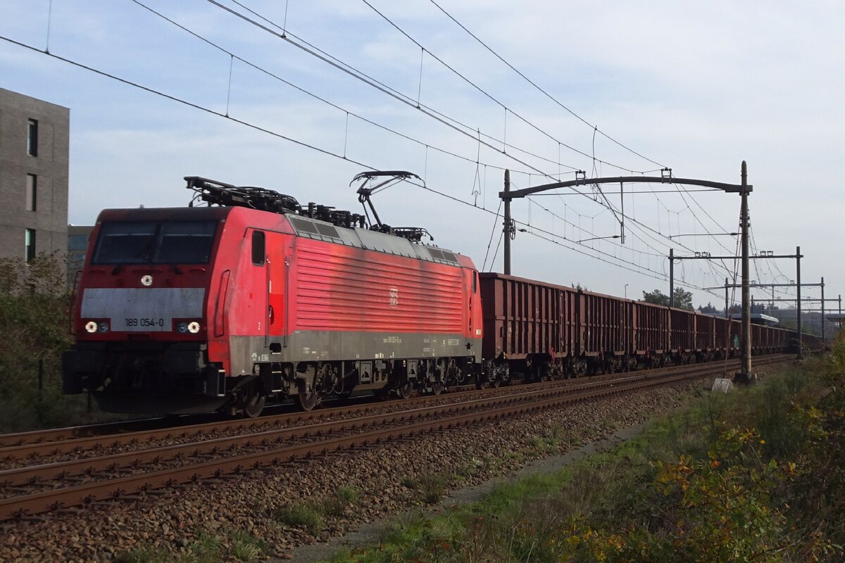 DBC 189 054 hauls a block train through Tilburg-Reeshof on 11 November 2022.