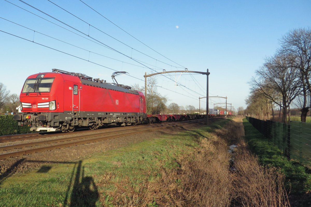 DBC 193 329 heads a sparsely loaded intermodal service through Oisterwijk on 24 February 2021.
