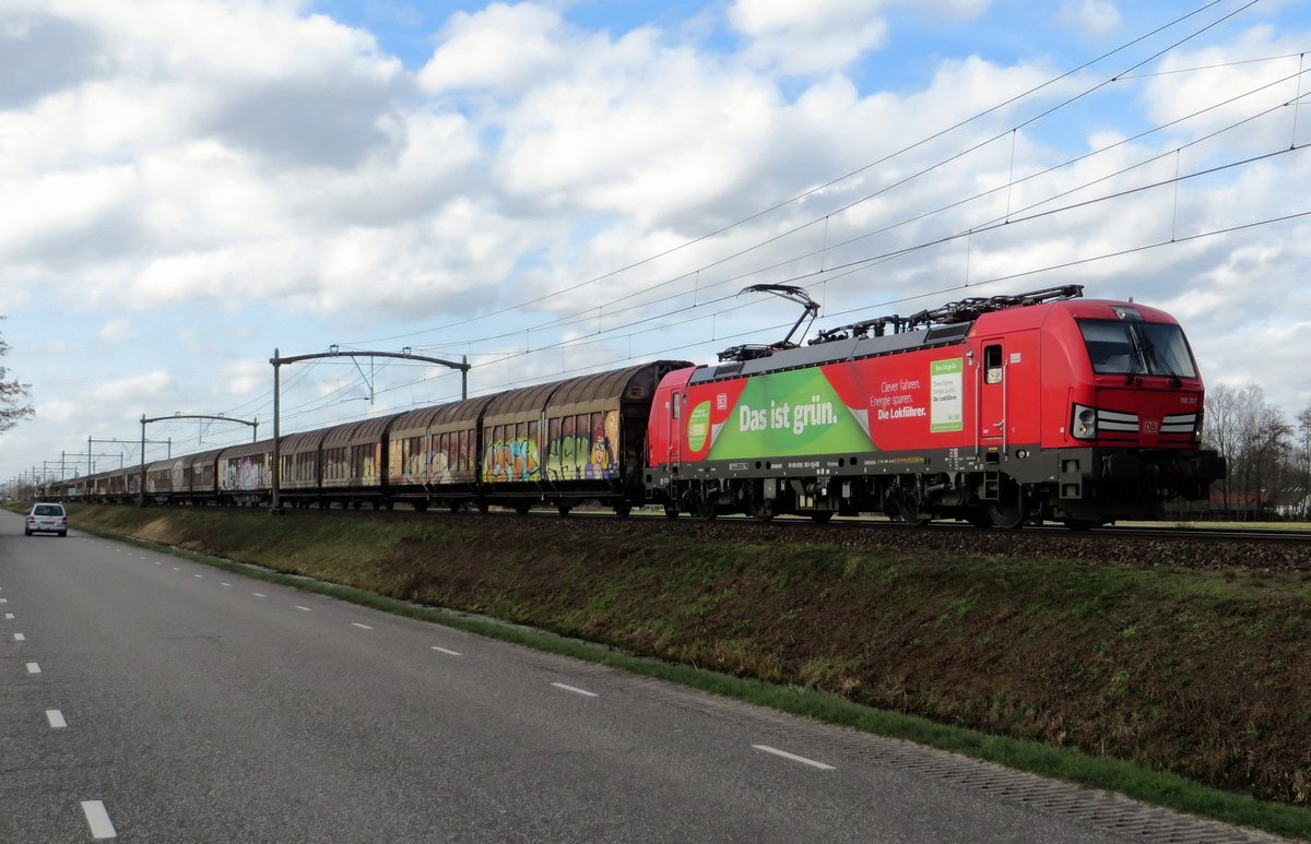 DBC 193 357 advertises the train as a green mode of transport while hauling a block train through Boxtel on 24 February 2021.