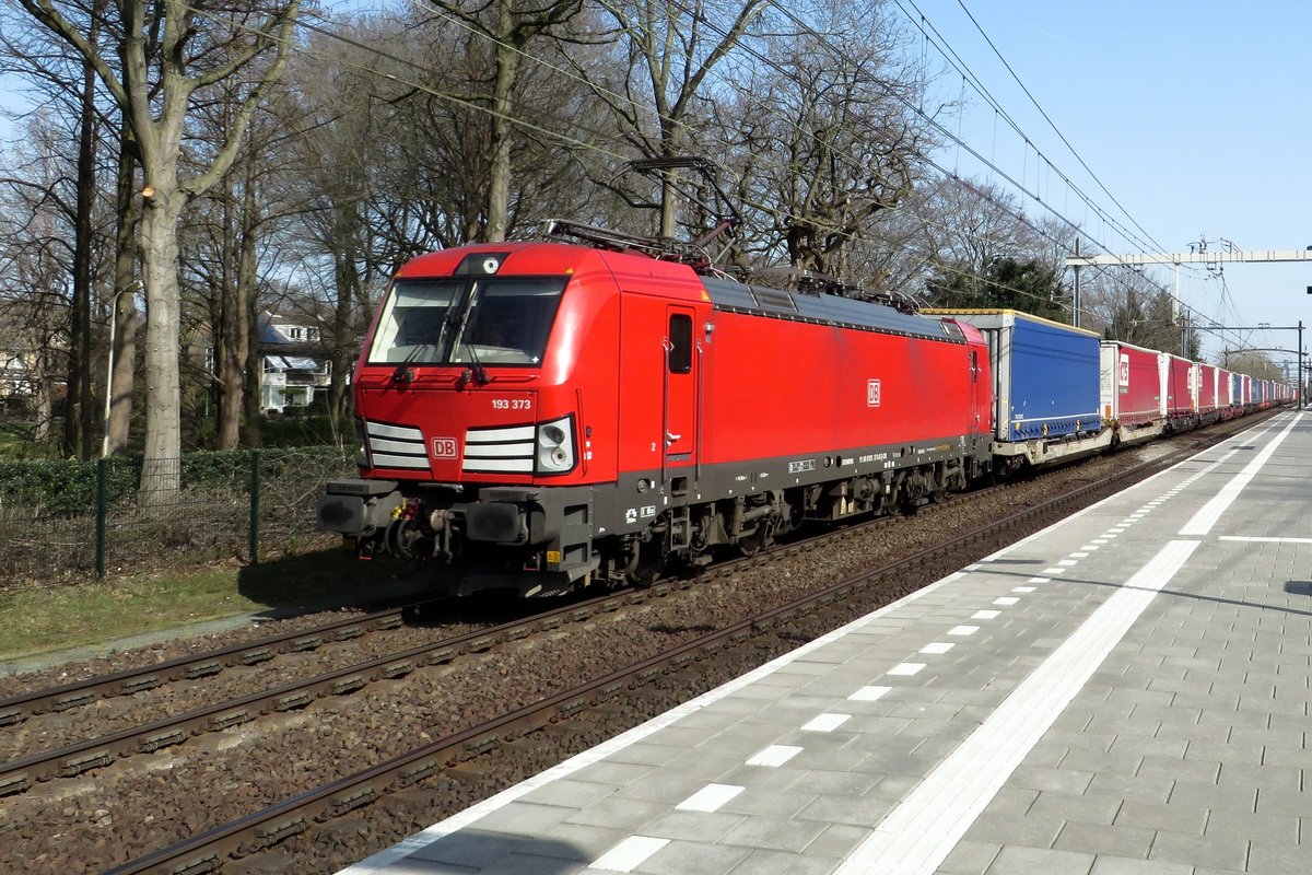 DBC 193 373 hauls an intermodal shuttle from LOvosice throguh Tilburg-Universiteit on 31 March 2021.