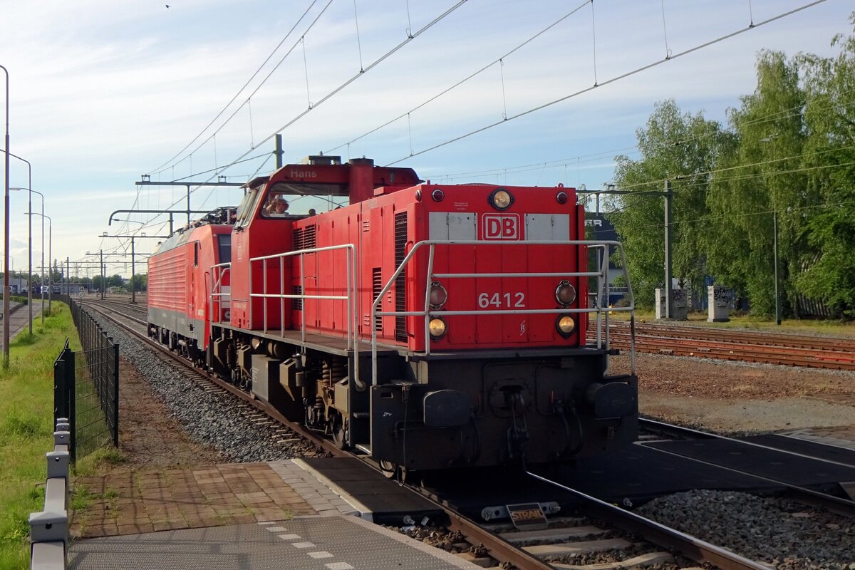 DBC 6412 hauls a Class 189 through Blerick on 28 May 2021.