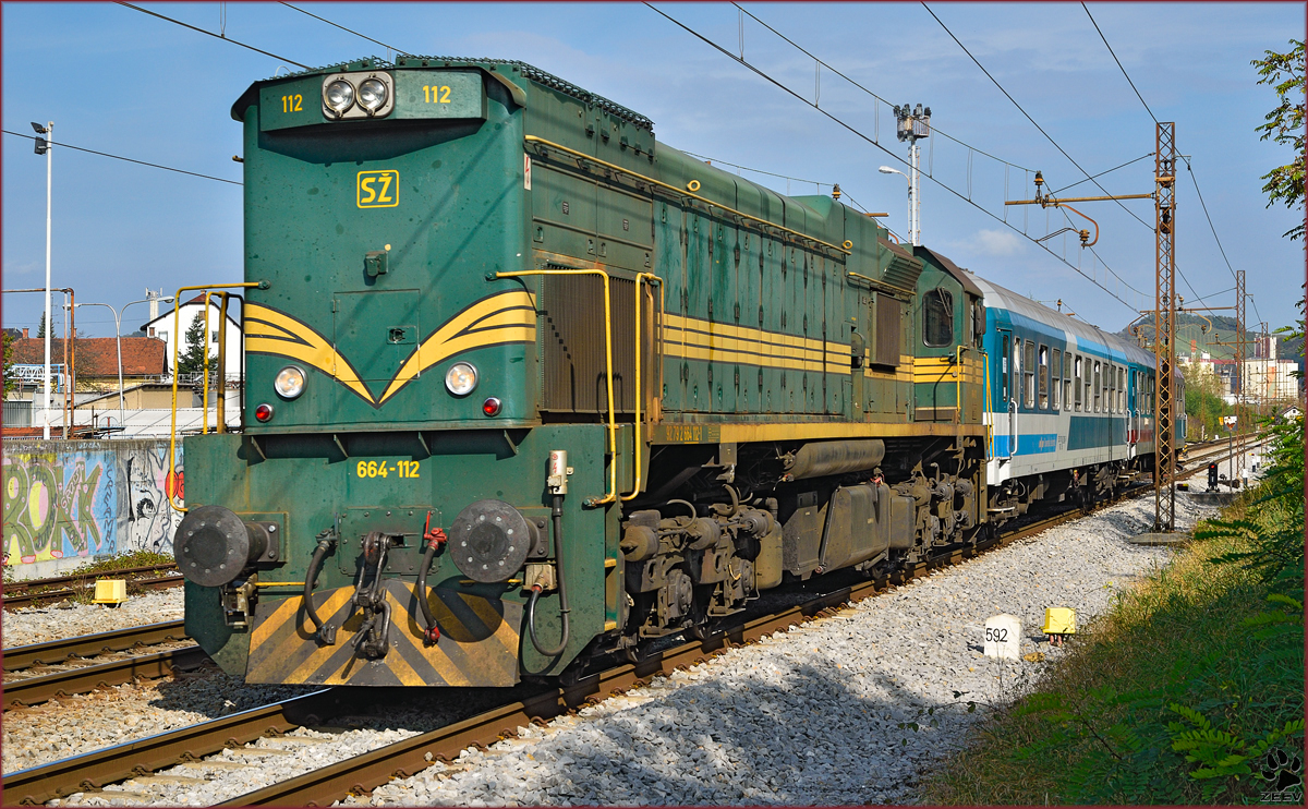 Diesel loc 664-112 pull MV247 'Citadella' through Maribor-Tabor on the way to Budapest. /21.10.2014