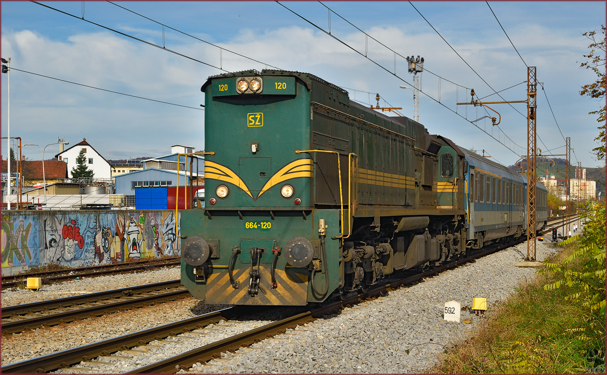 Diesel loc 664-120 pull MV247 'Citadella' through Maribor-Tabor on the way to Budapest. /11.11.2014