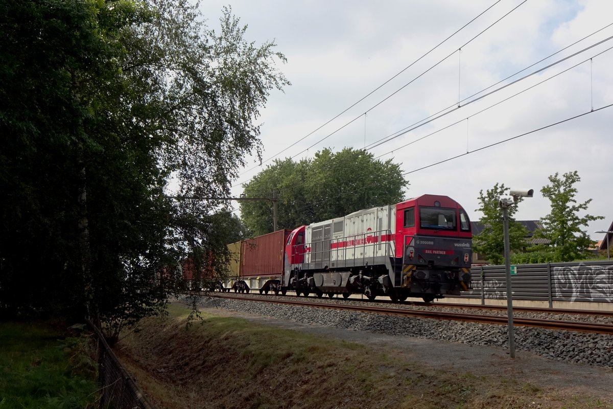 Diverted Coevorden-Shuttle container train passes through Wijchen on 1 August 2020 with IRP 2106 banking.IRP is a daughter operator of Lineas.
