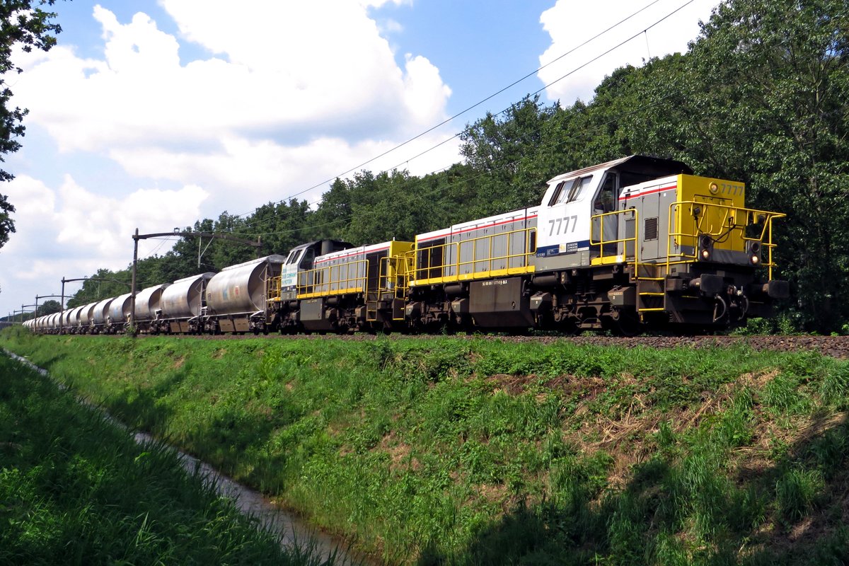 Diverted Dolime train headed by 7777 passes through Tilburg Oude Warande on 18 July 2020.