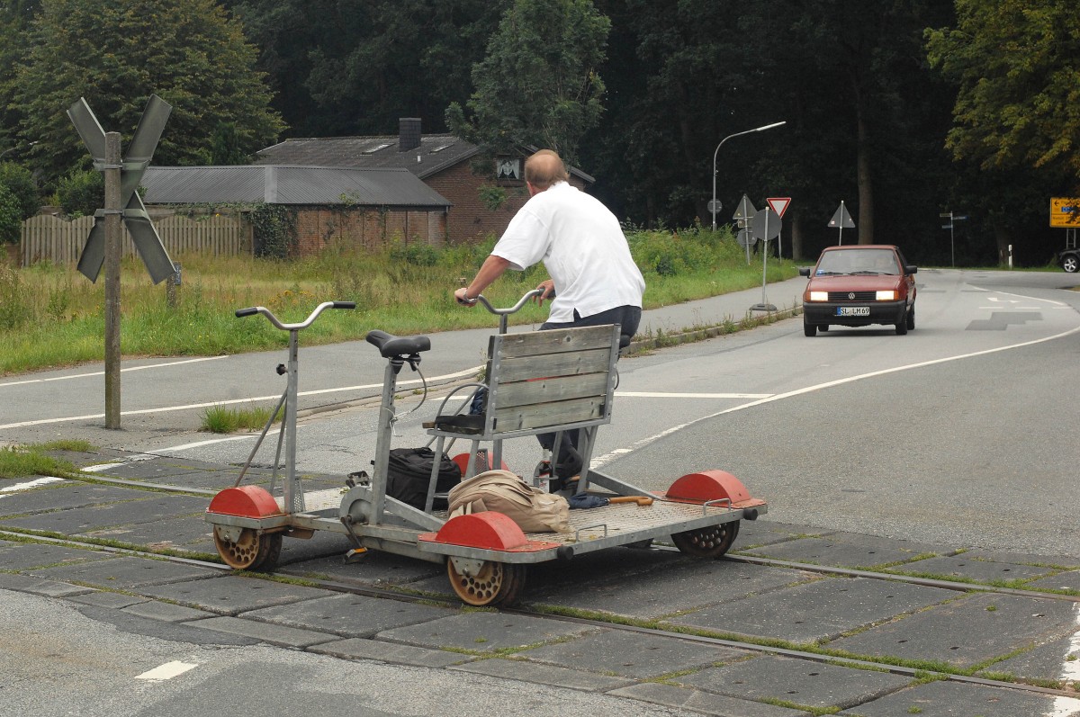 Draisine rail bike from Leck to Unaften in Schleswig-Holstein (North Germany). Date: 2. August 2011.