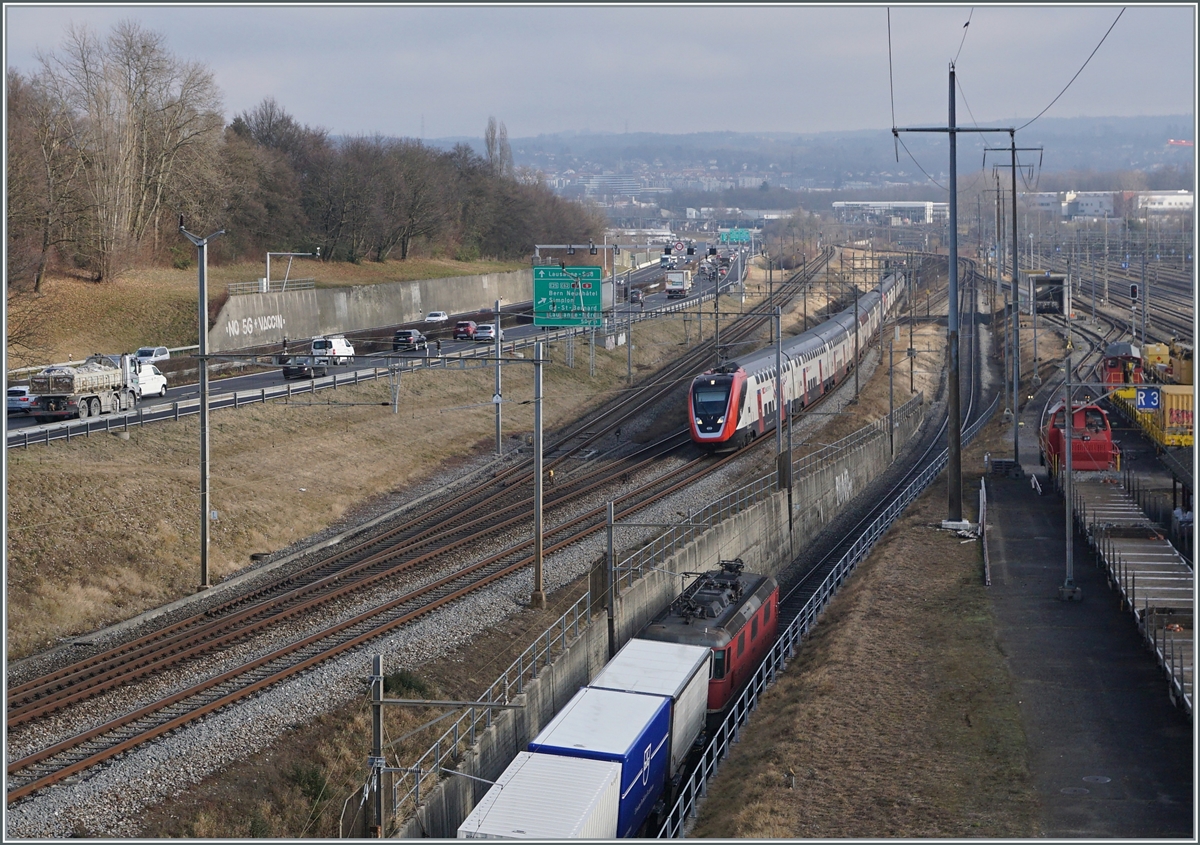 During the SBB RABDe 502 009-9  Stadt St.Gallen and an other one aare on the way to Geneva Airport, leavs a Cargo service the Lausanne Triage Station. 

04.02.2002

