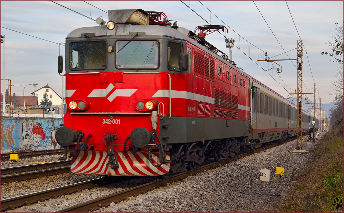 Electric loc 342-001 is hauling EC151 'Emona' through Maribor-Tabor on the way to Ljubljana. / 20.12.2013