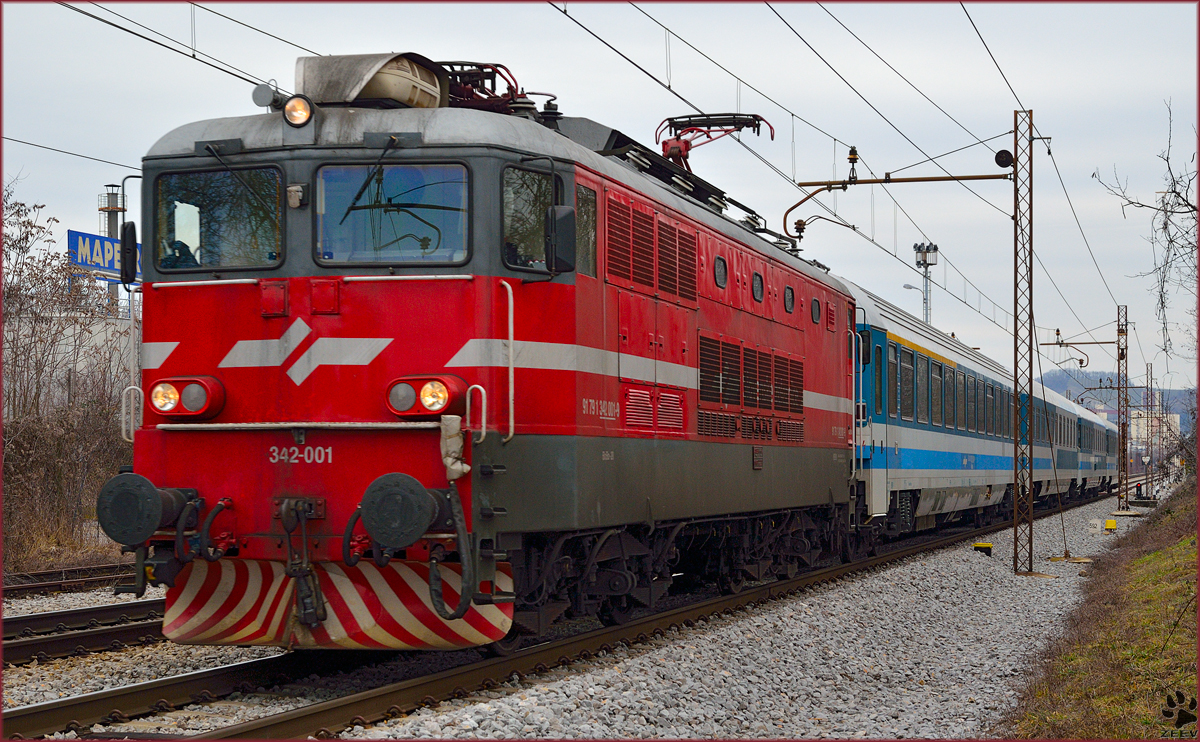 Electric loc 342-001 is hauling EC151 'Emona' through Maribor-Tabor on the way to Ljubljana. /20.2.2014