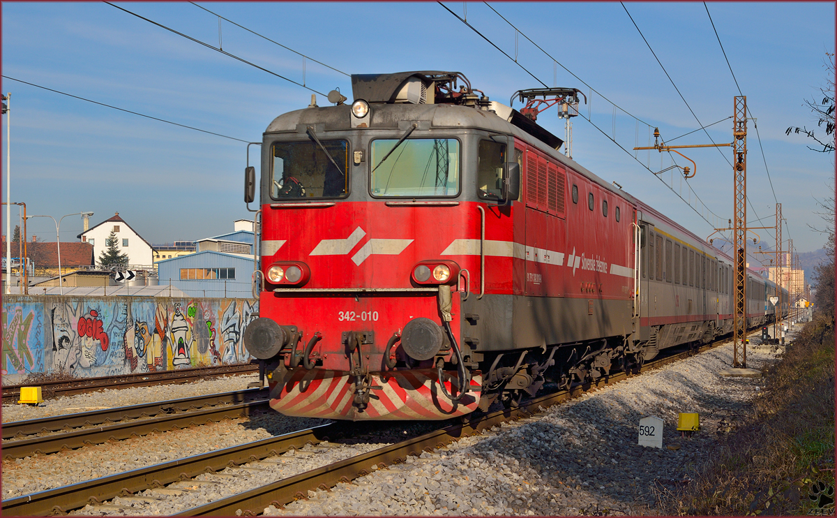 Electric loc 342-010 is hauling EC151 'Emona' through Maribor-Tabor on the way to Ljubljana. /23.12.2013