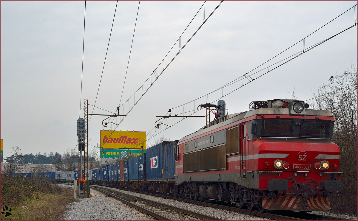 Electric loc 363-003 is hauling container train through Maribor-Tabor on the way to the north. /3.3.2014