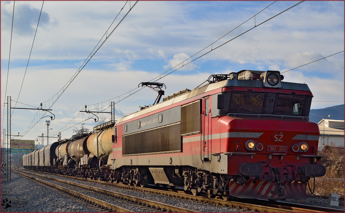 Electric loc 363-003 pull freight train through Maribor-Tabor on the way to the north. /2.1.2014