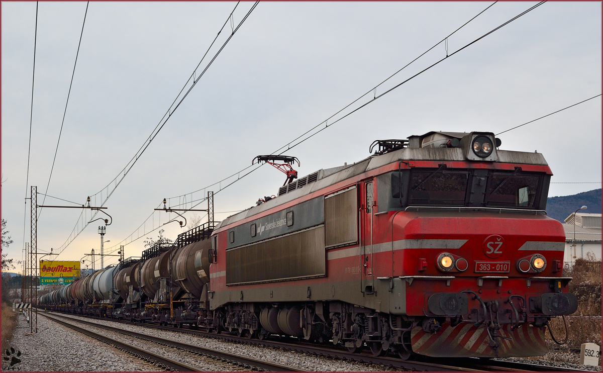 Electric loc 363-010 is hauling freight train through Maribor-Tabor on the way to the north. /7.1.2014