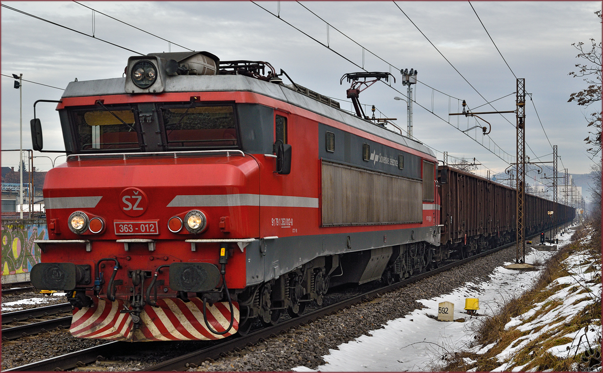Electric loc 363-012 pull freight train through Maribor-Tabor on the way to the south. /9.1.2015
