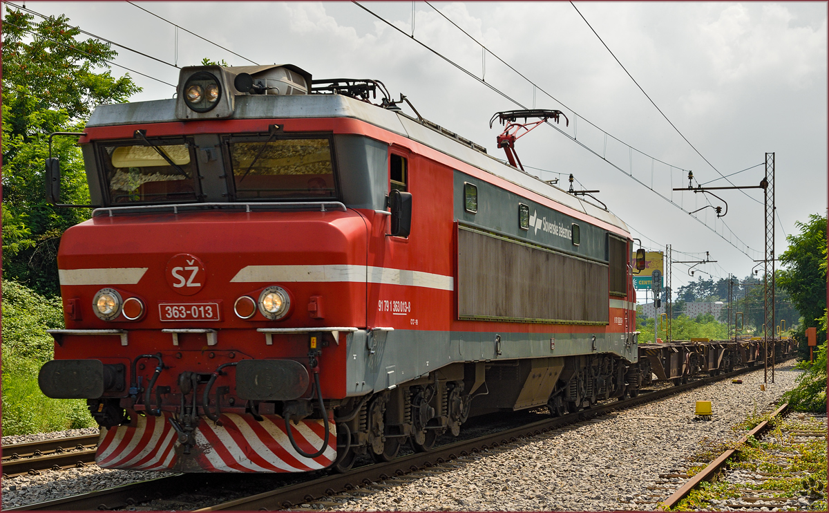 Electric loc 363-013 pull freight train through Maribor-Tabor on the way to the north. /26.7.2014