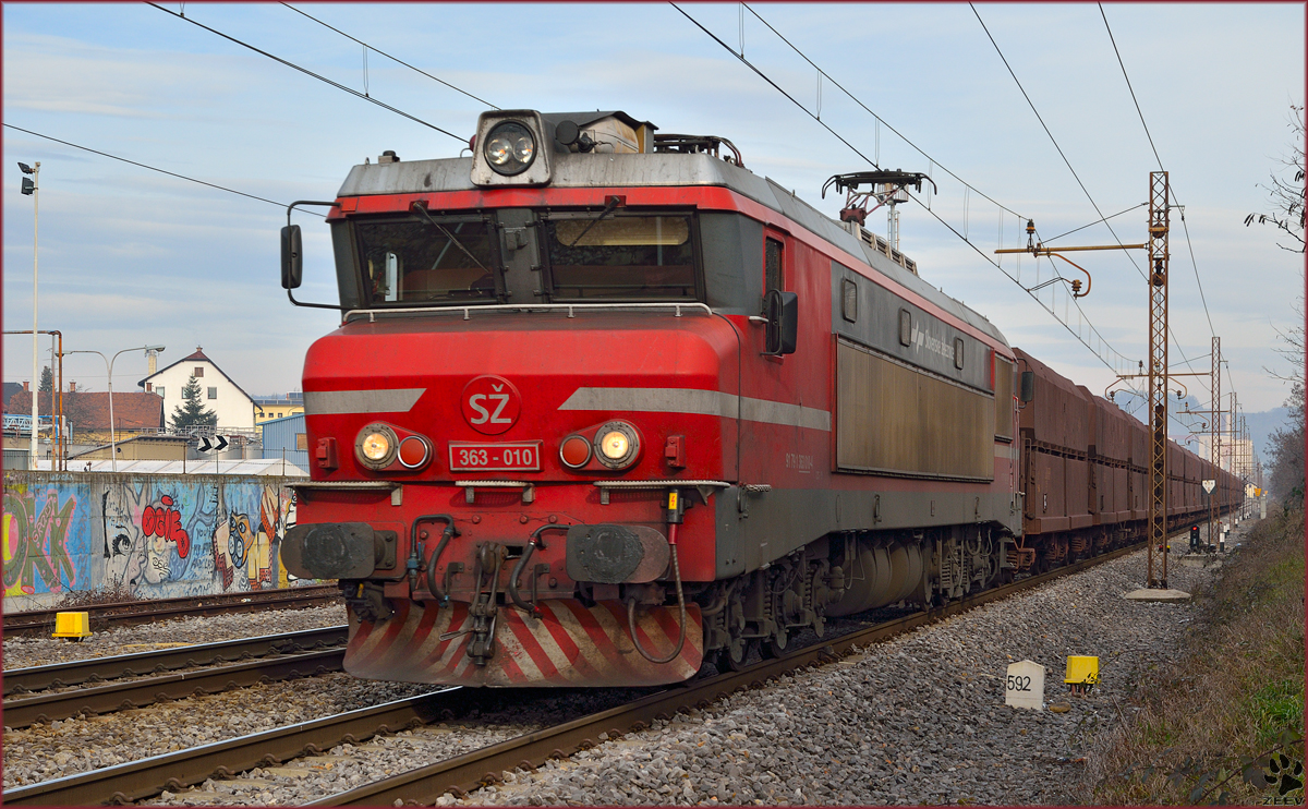 Electric loc 363-018 is hauling freight train through Maribor-Tabor on the way to Koper port. /20.12.2013