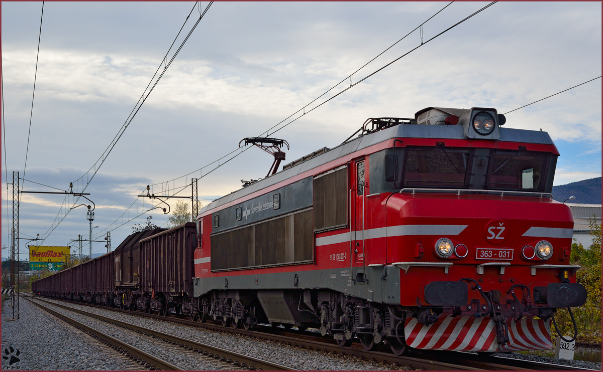 Electric loc 363-031 pull freight train through Maribor-Tabor on the way to the north. /8.11.2013