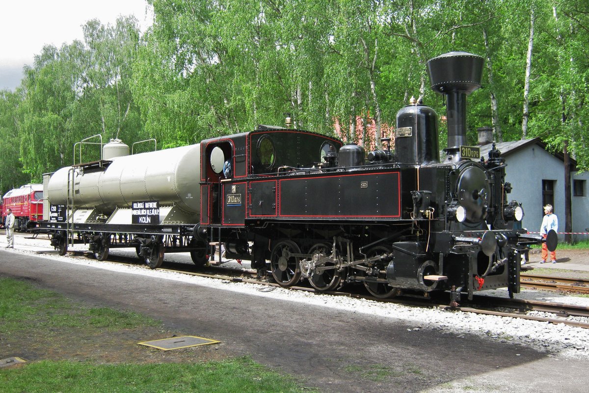 Ex-CSD 310 076 stands in the railway museum at Luzna u Rakovnika and is seen with a milk tank wagon on 13 May 2012.