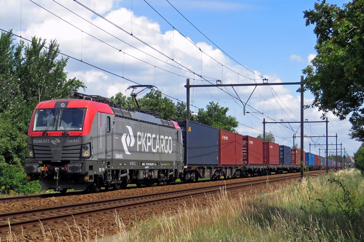 Far away from home, PKP Cargo EU46-513 hauls a container train to Tilburg-Industrie throguh Wijchen on 7 July 2020.