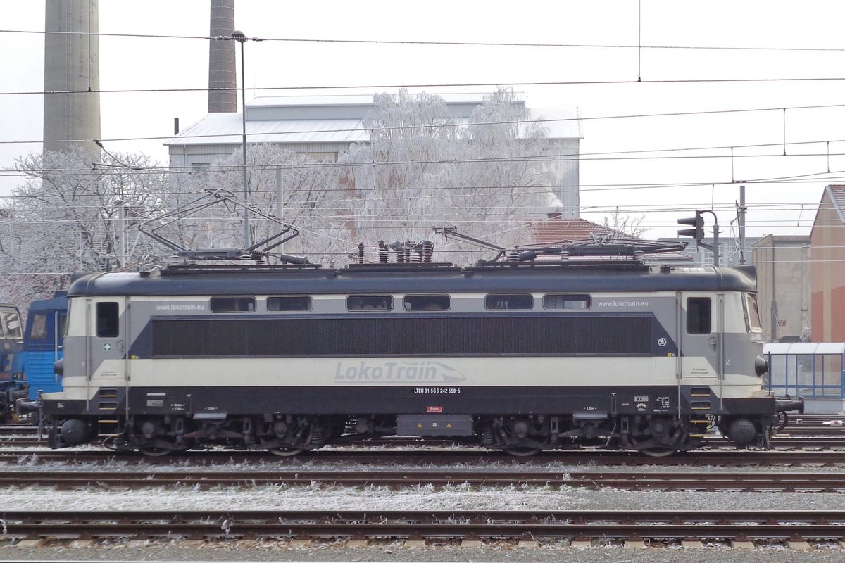 Fifty shades of grey? Grey, grey and grey with black elements are seen on LokoTrain 242 558 at Breclav on a grey first day in 2017.