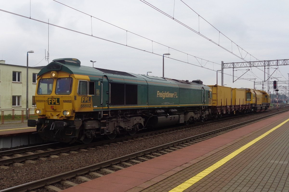 Freightliner Poland 66602 hauls an engineering machine through Rzepin on a grey morning of 3 May 2018.