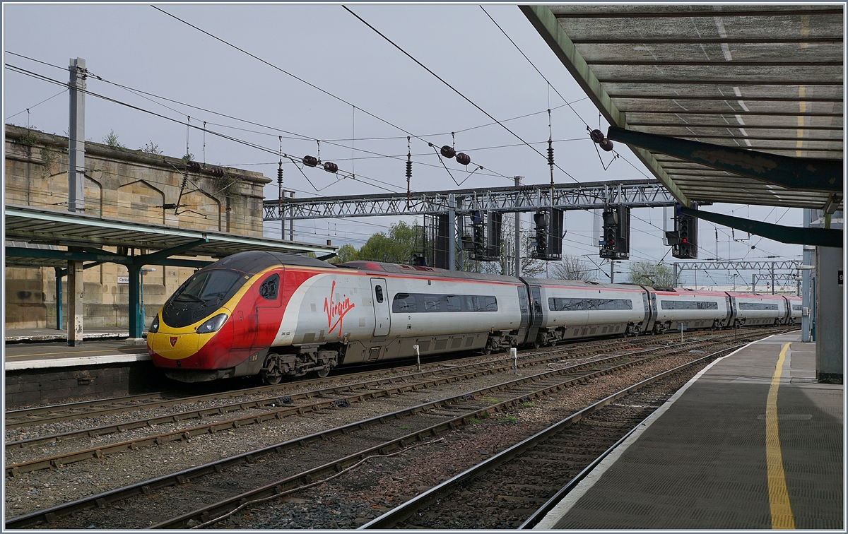 he Virgin Pendolino 390 122 on the way to London Euston is leaving Carlisle.
27.04.2018