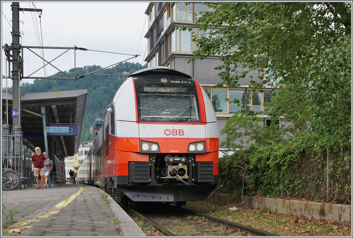 In Bregenz Hafen is waiting the ÖBB 4748 511-4 to Bludenz his depatrue. This pictures was token on the open X-Crossing to the plattform. 

18.06.2023