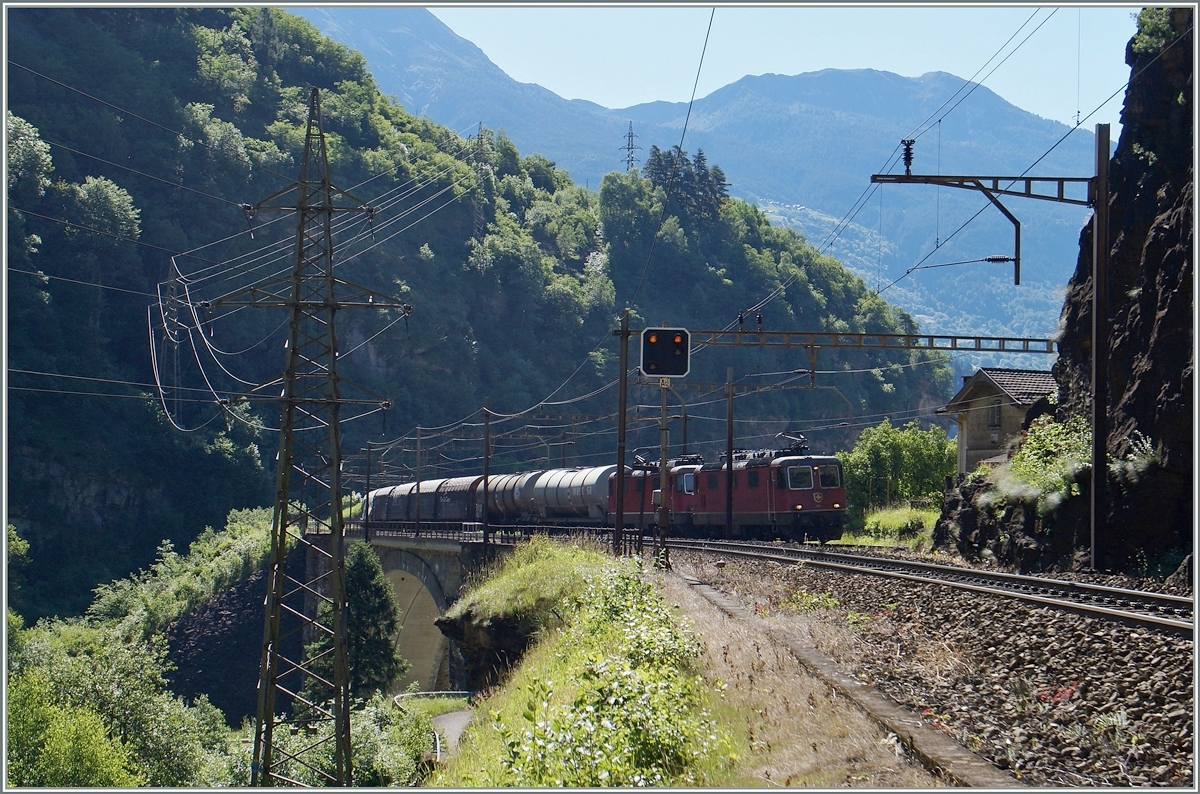 In the dark valley ot the Leventia by Faido are runing two SBB Re 4/4 II with his Carogo train to Airolo.
24.06.2015