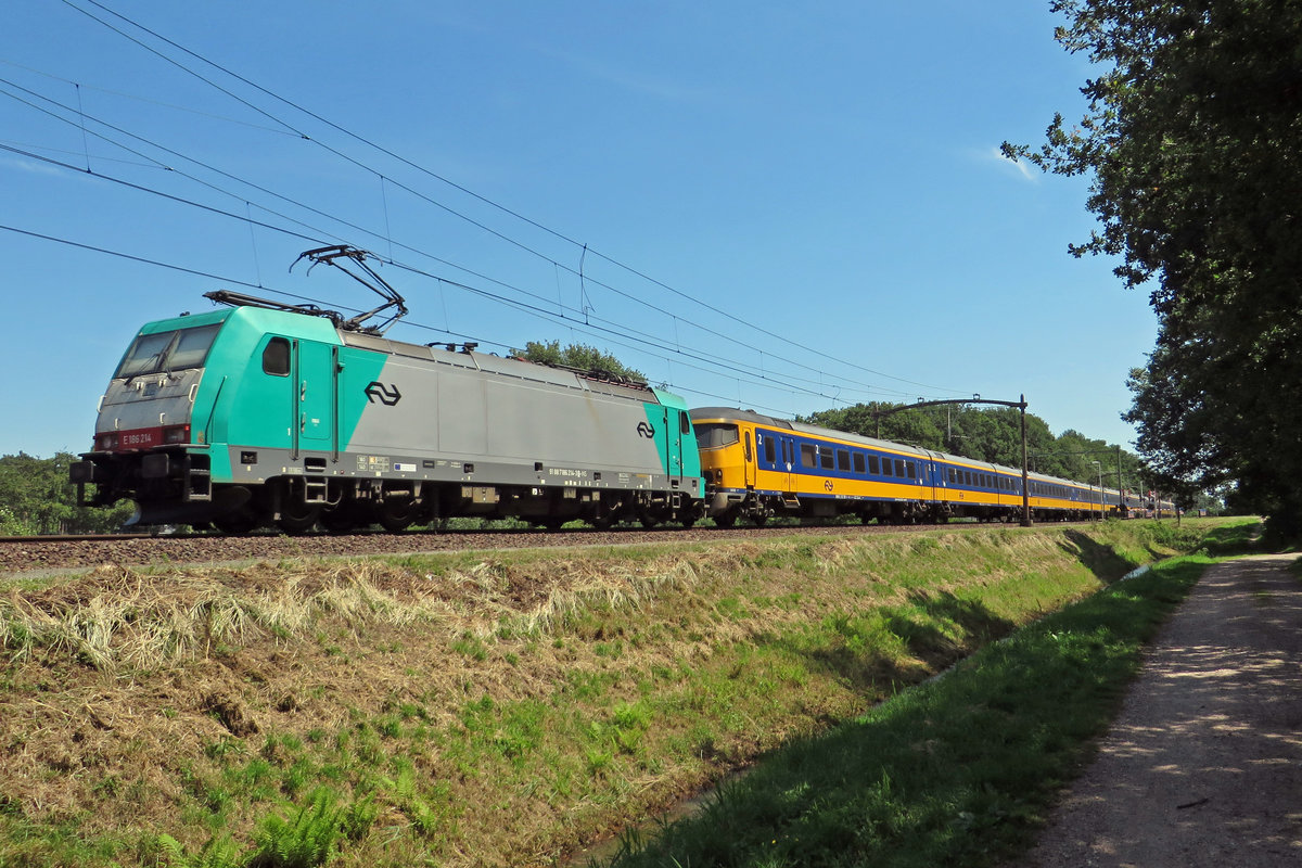 InterCity to Eindhoven is banked by 186 214 at Tilburg Oude Warande on 24 June 2020.