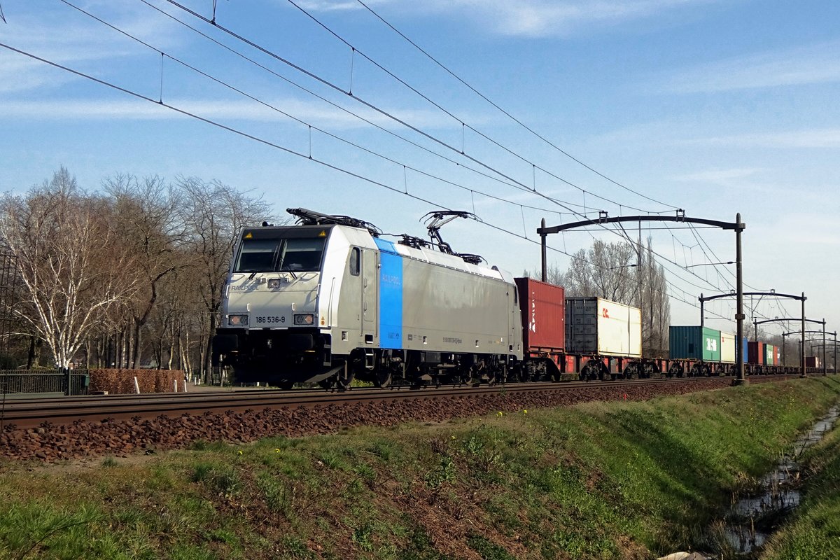 KRE's newby 186 536 passes through Roond with a container train on 30 March 2021.