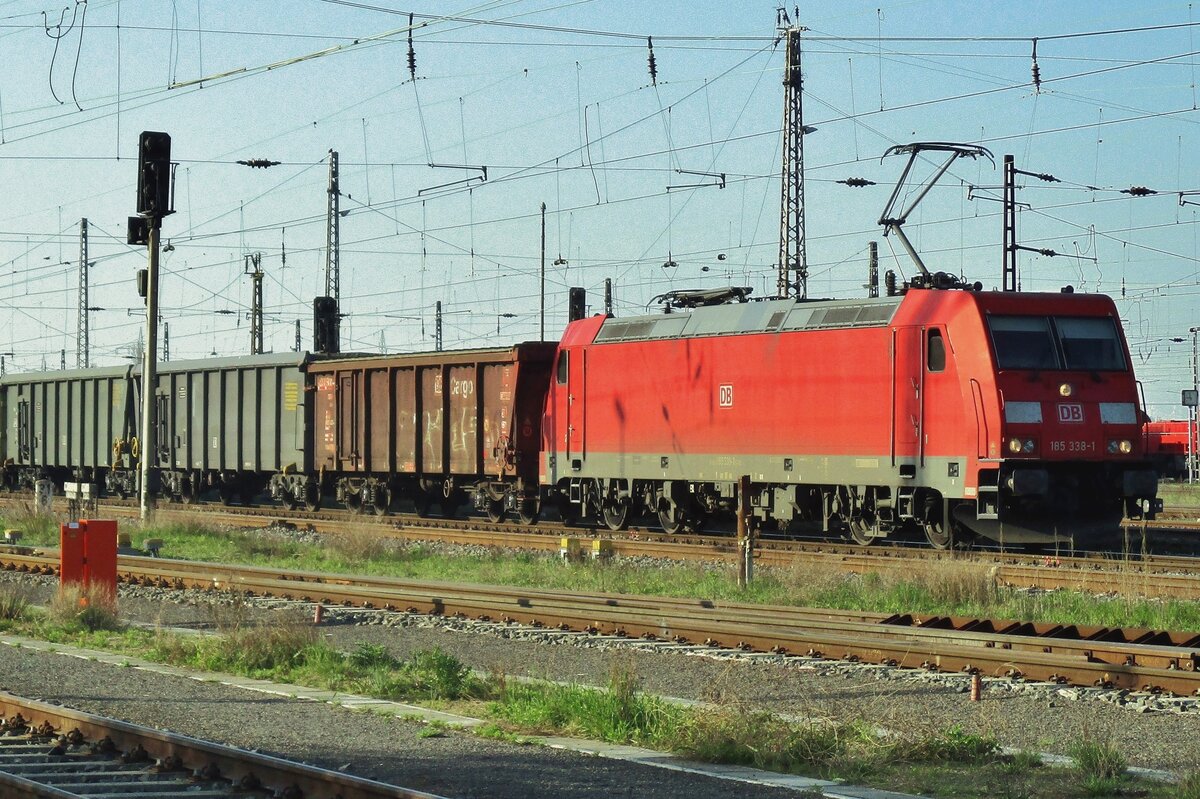 Lead ore train headed by 185 338 awaits departure at Grosskorbetha on 10 April 2017.