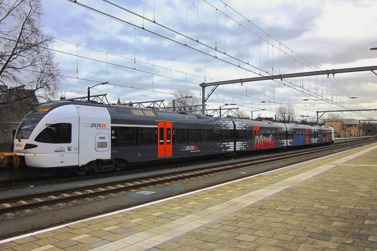 Less than nice encouragement as a graffiti on EuroBahn ET6-04 at venlo on 31 December 2012; the German  Raus  means  Out!  or  Get off .