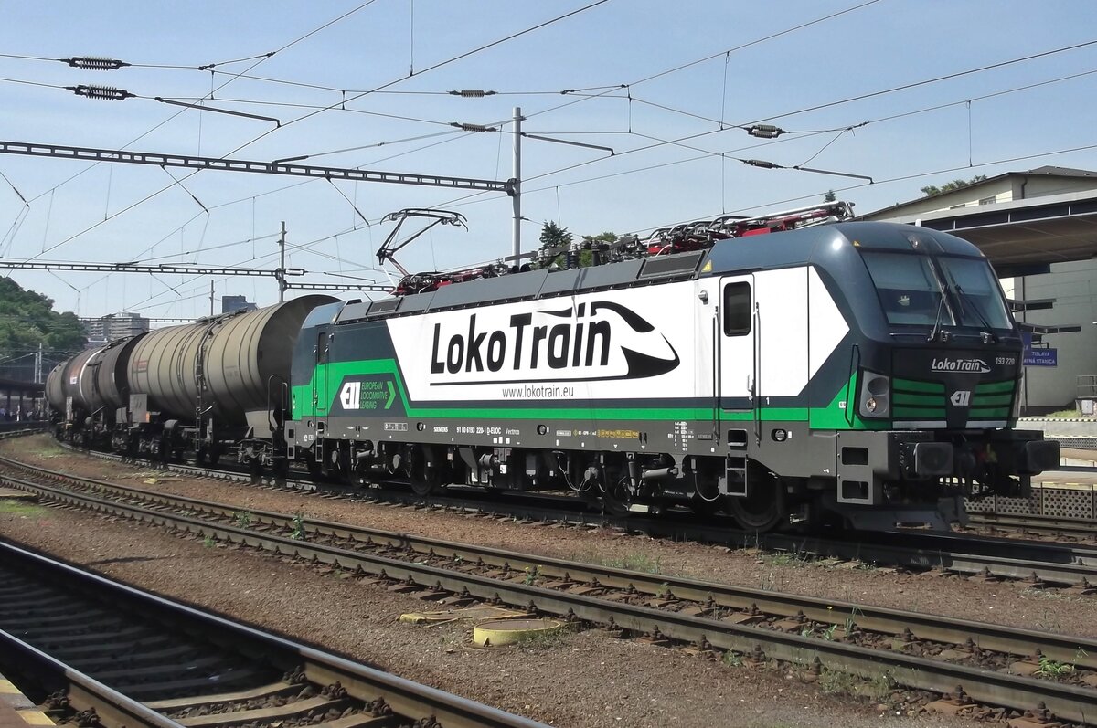 LokoTrain 193 220 banks a tank train through Bratislava hl.st. on 29 May 2015.