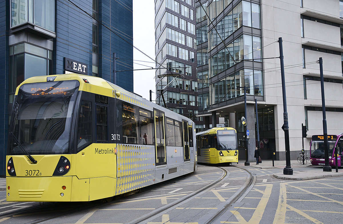 Manchester Metro Link Trams 3072 and 3111 (Bombardier M5000) crossing Aytoun Street in the city centre of Manchester. Date: March 11, 2018.