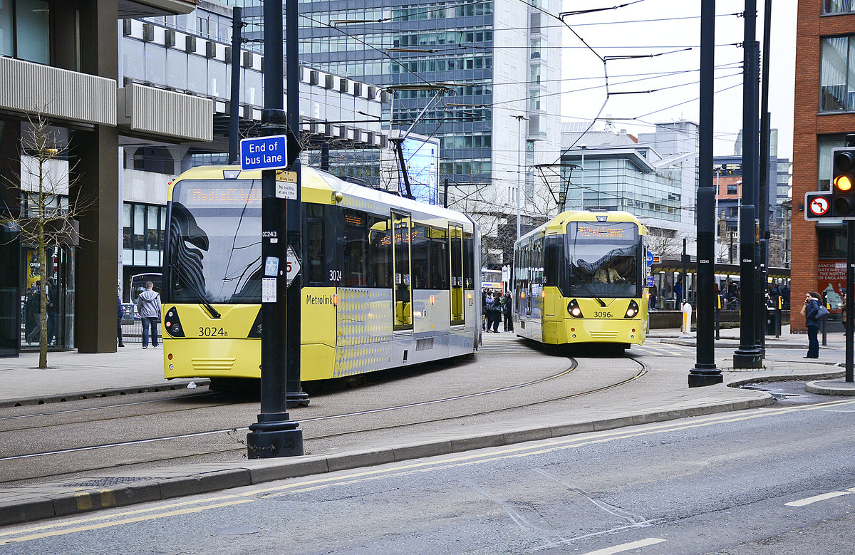 Manchester Metrolink Trams 3024 and 3096 (Bombardier M 5000) crossing Portland Street near the station Piccadilly Gardens. Date: 11. march 2018.