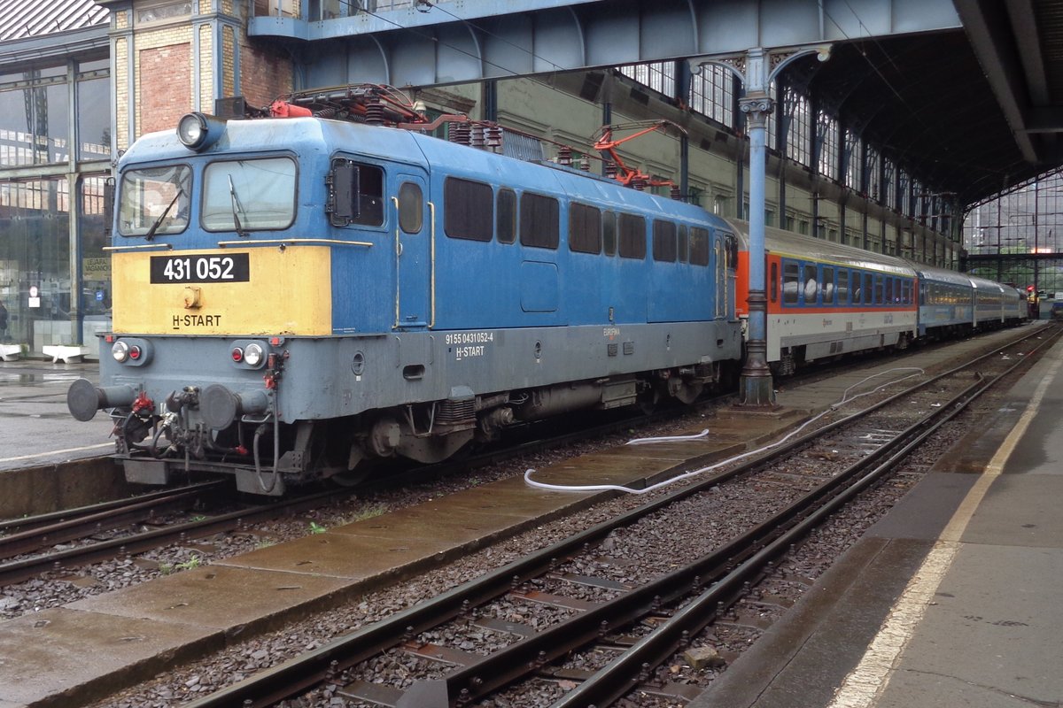 MAV 431 052 stands ready for departure at Budapest-Nyugato with the first coach in a new tested colour scheme on 19 September 2017.