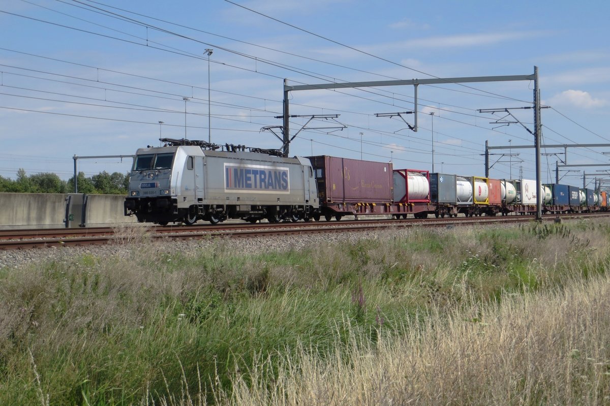 Metrans 386 030 hauls an intermodal shuttle from Praha-Uhrineves through Valburg CUP on 23 July 2020.