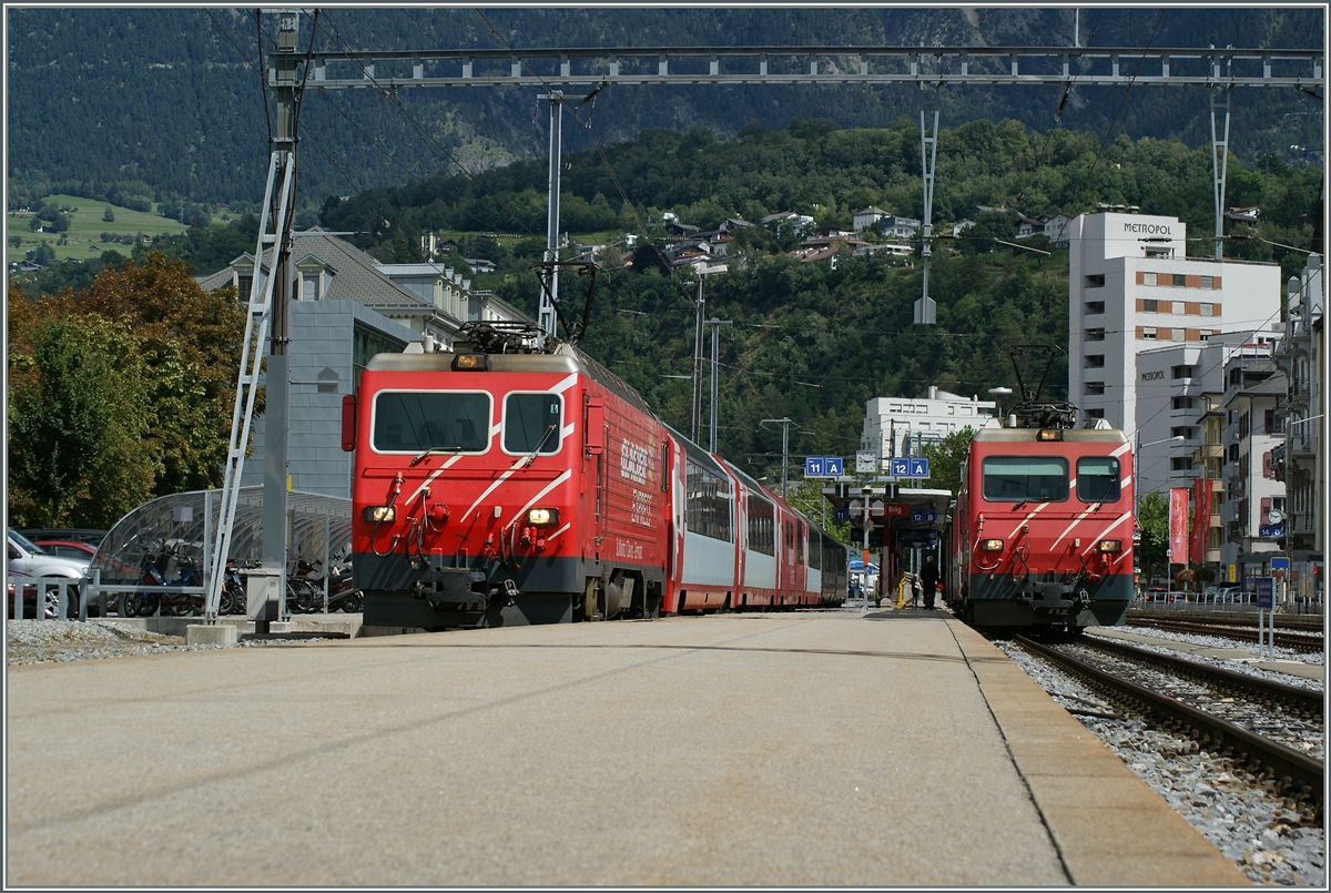 MGB HGe 4/4 with Glacier Express an local Train du Zermatt in Brig. 
16.08.2014