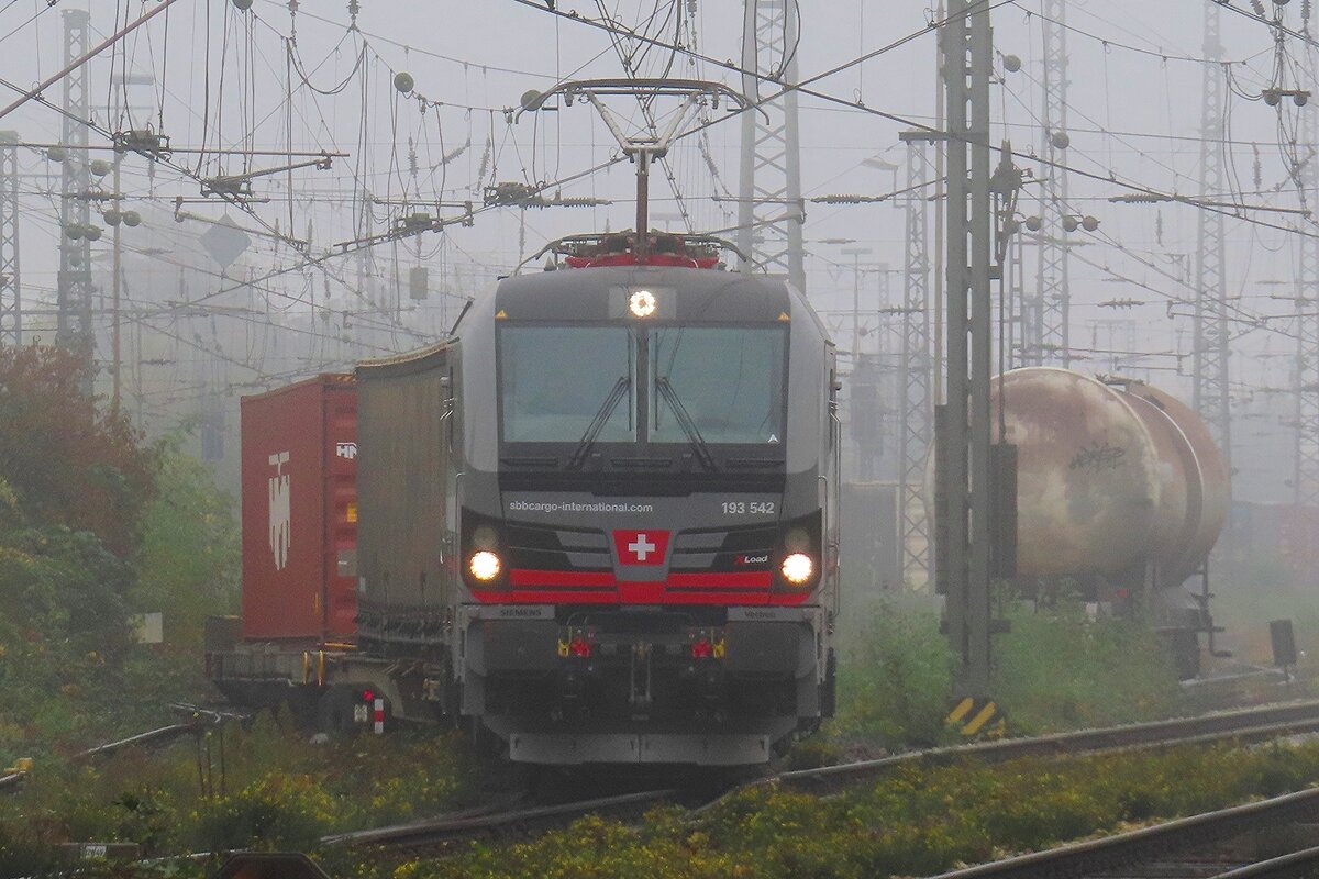 Misty! SBBCI XLoad 193 542 pops up out of the fog at Emmerich with a Kijfhoek bound container train on 23 October 2024.